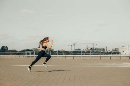 A girls running on a walkway